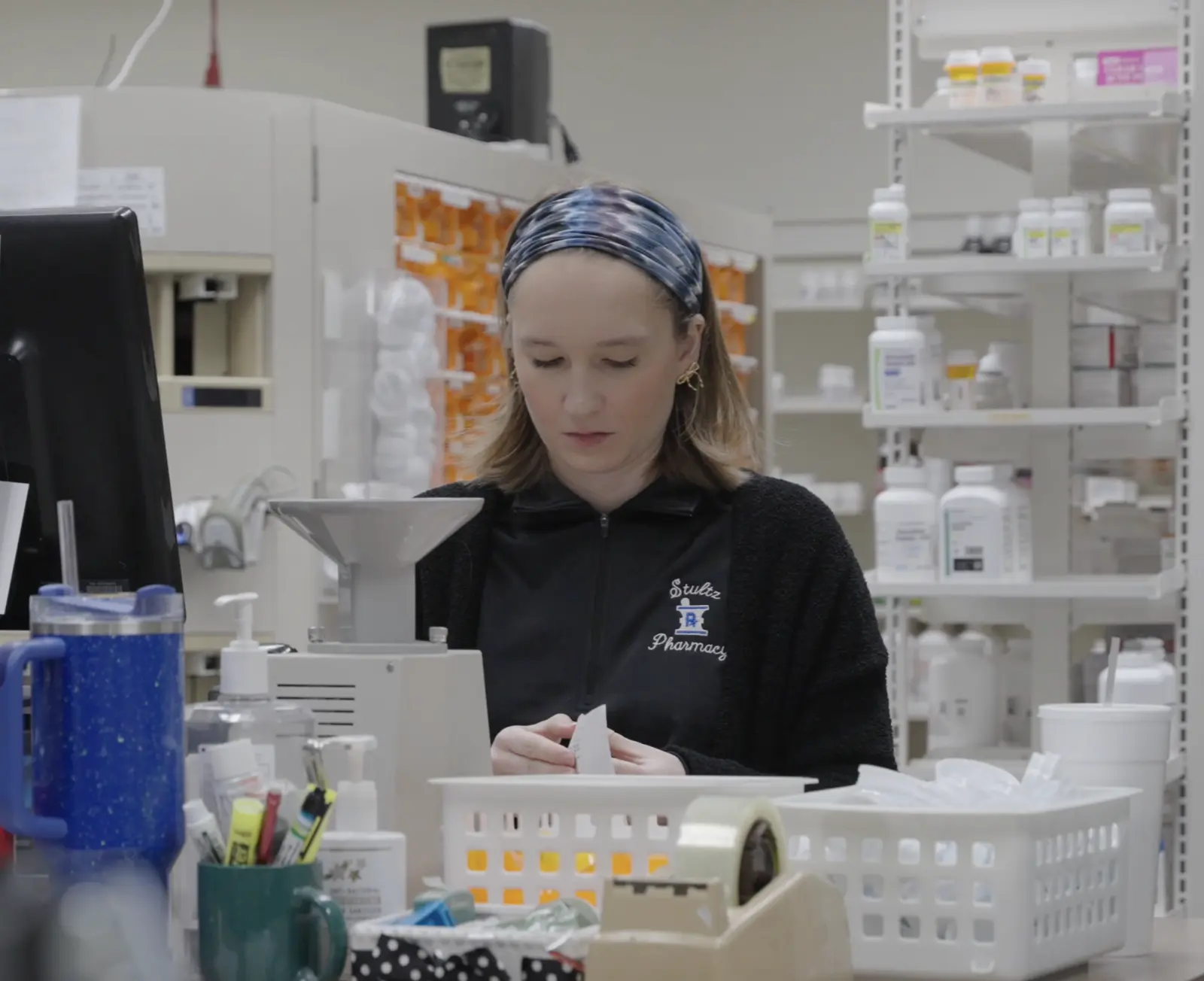 A Stultz Pharmacy team member preparing a prescription
