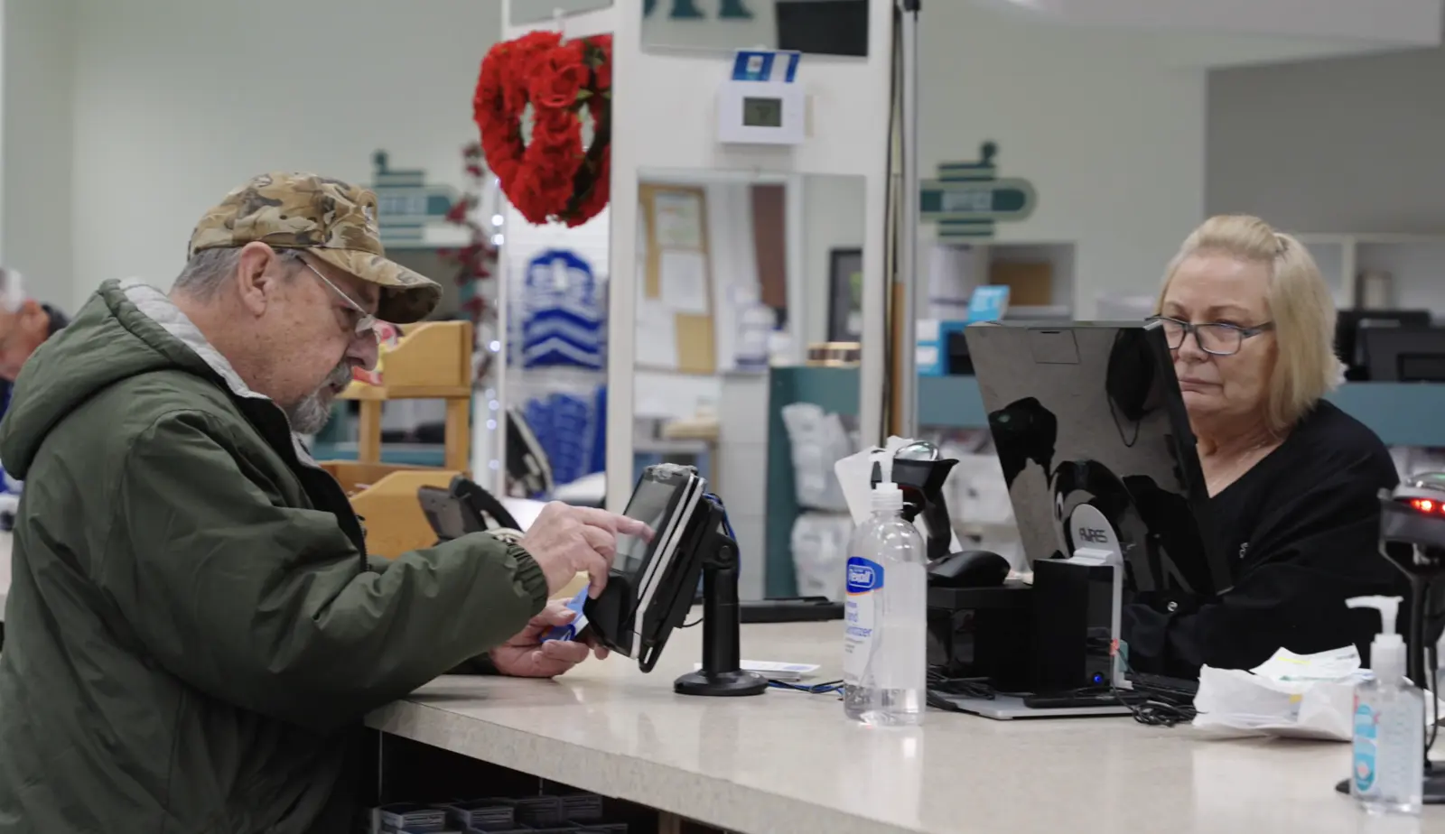 A customer being helped at the Stultz Pharmacy counter