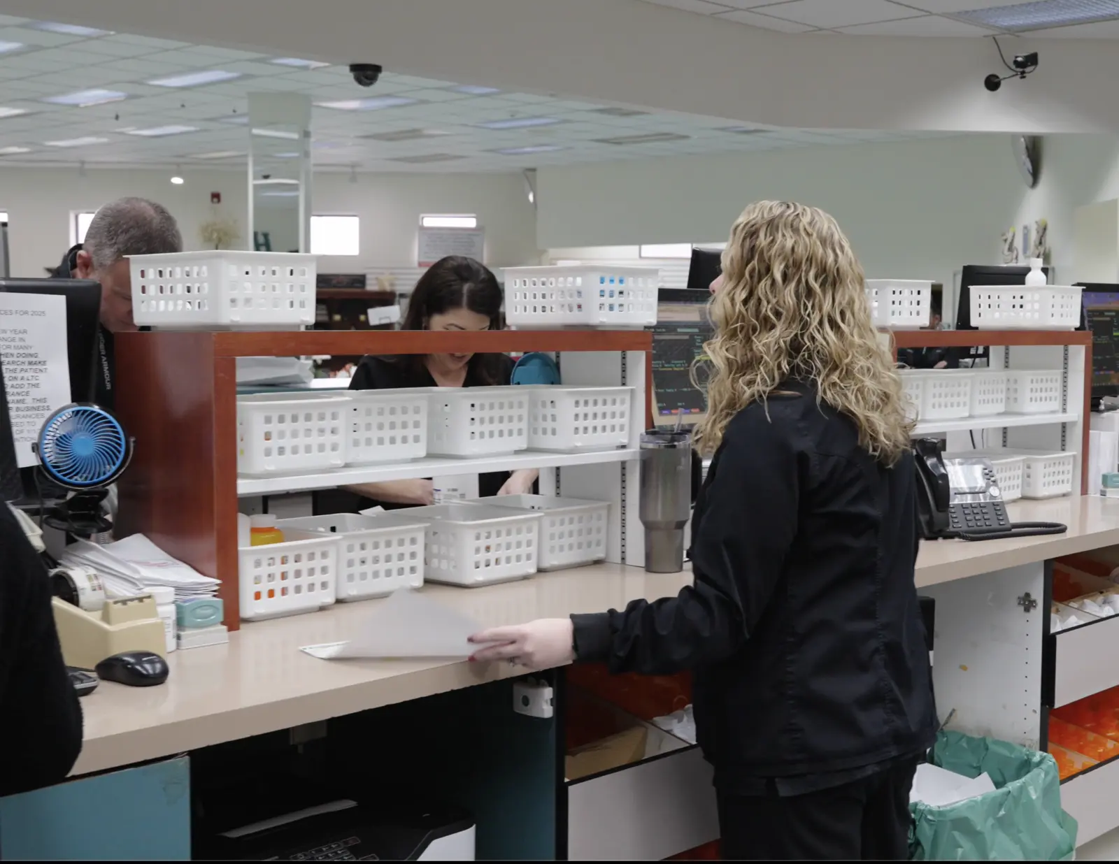 The Stultz Pharmacy team working behind the counter